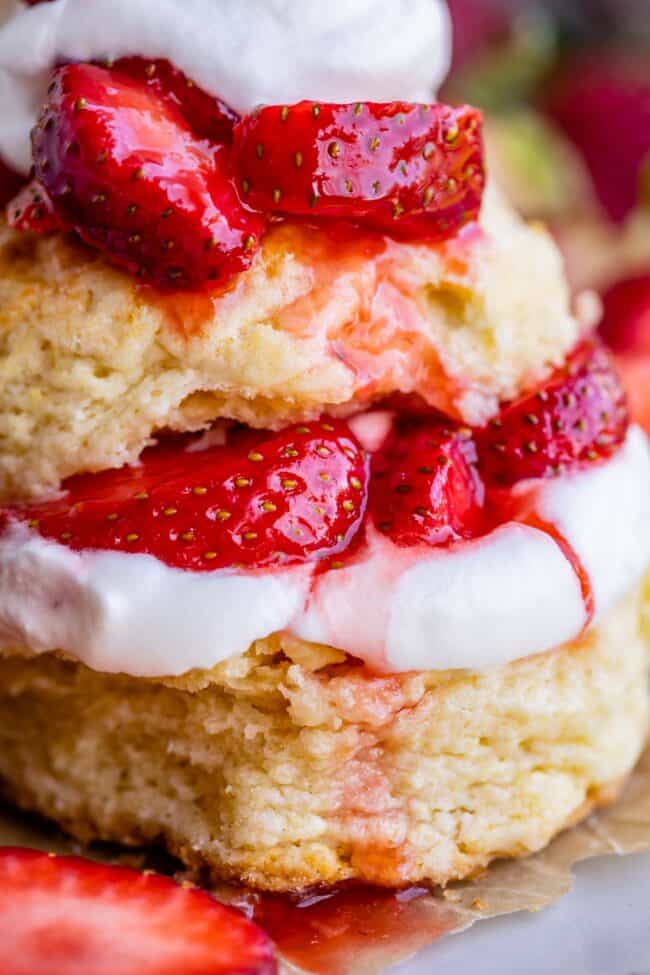 classic strawberry shortcake with biscuits, whipped cream, and berries.