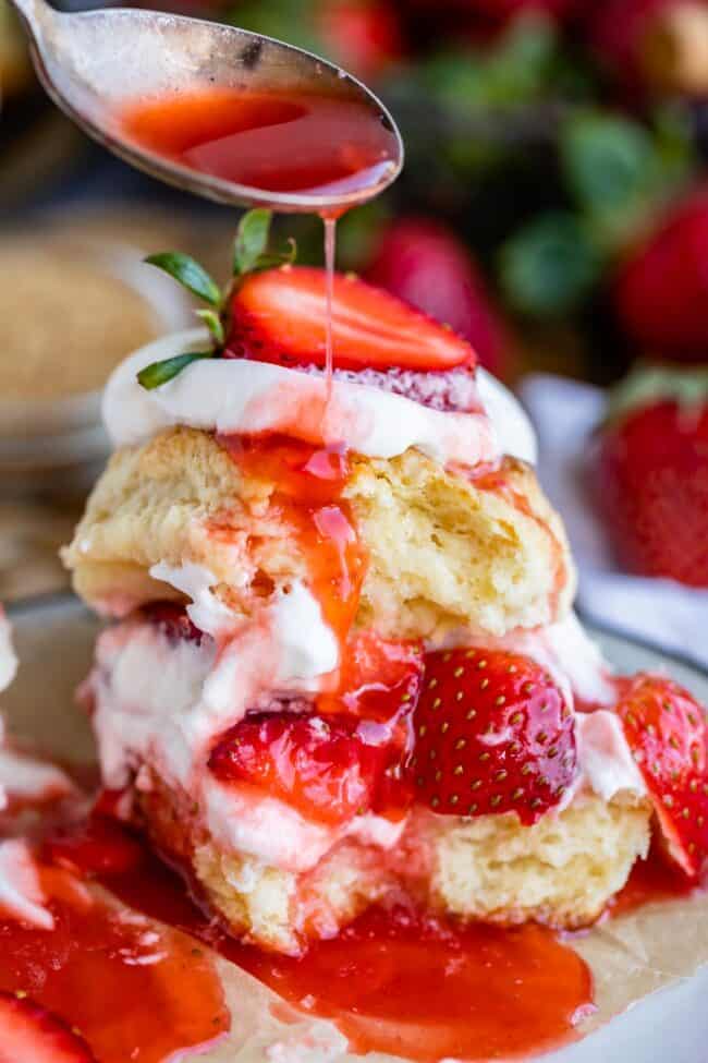 drizzling juice over classic strawberry shortcake