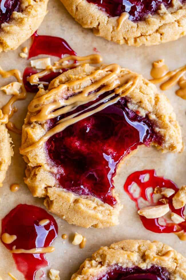 pb&j cookies with jam on top and drizzled peanut butter on the edge