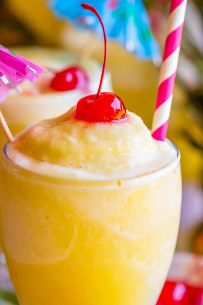 virgin pina colada with a cherry, straw, and umbrella.