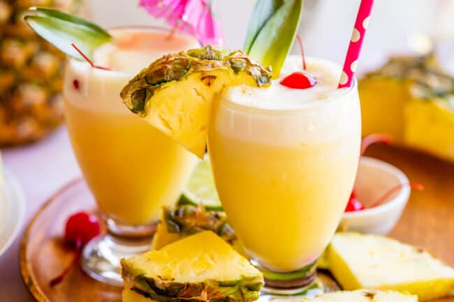 homemade virgin pina coladas on a wooden plate.