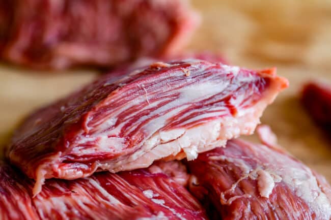 cross section slice of outside skirt steak showing fat pockets.