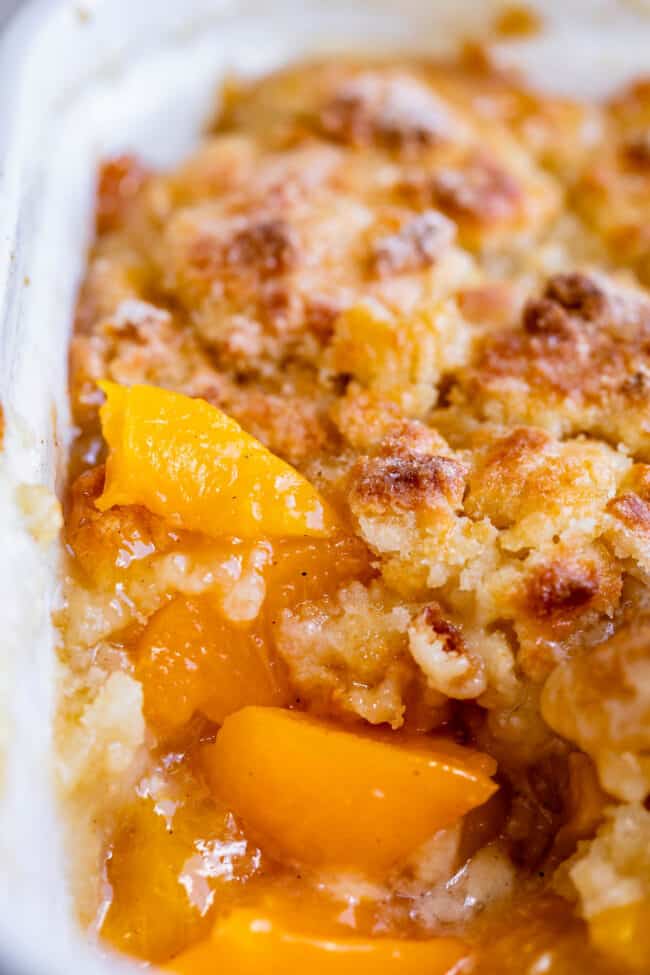 peach cobbler recipe in a pan from the side.