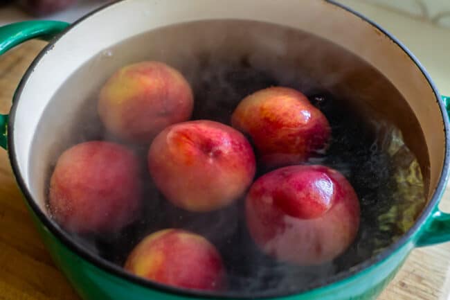 how to peel peaches by blanching in a pot of water.