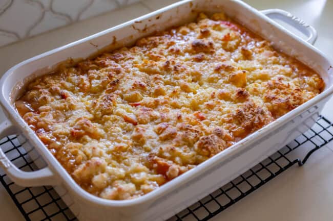 baked peach cobbler right out of the oven on a cooling rack