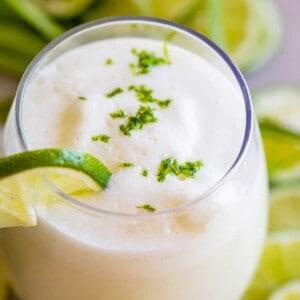 brazilian limeade in a glass with lime garnish