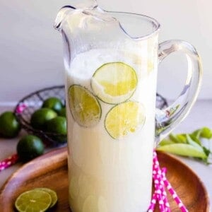 Brazilian lemonade recipe in a tall clear glass pitcher