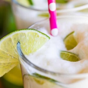 Brazilian limeade recipe in a glass with foam on top