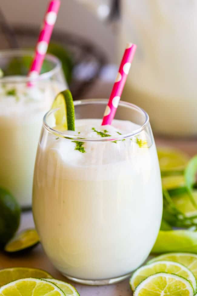 brazilian lemonade in a glass with a pink polka dot straw.