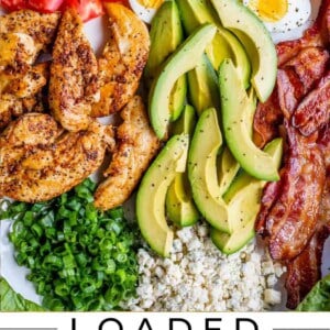 ingredients for cobb salad lined up on a white platter