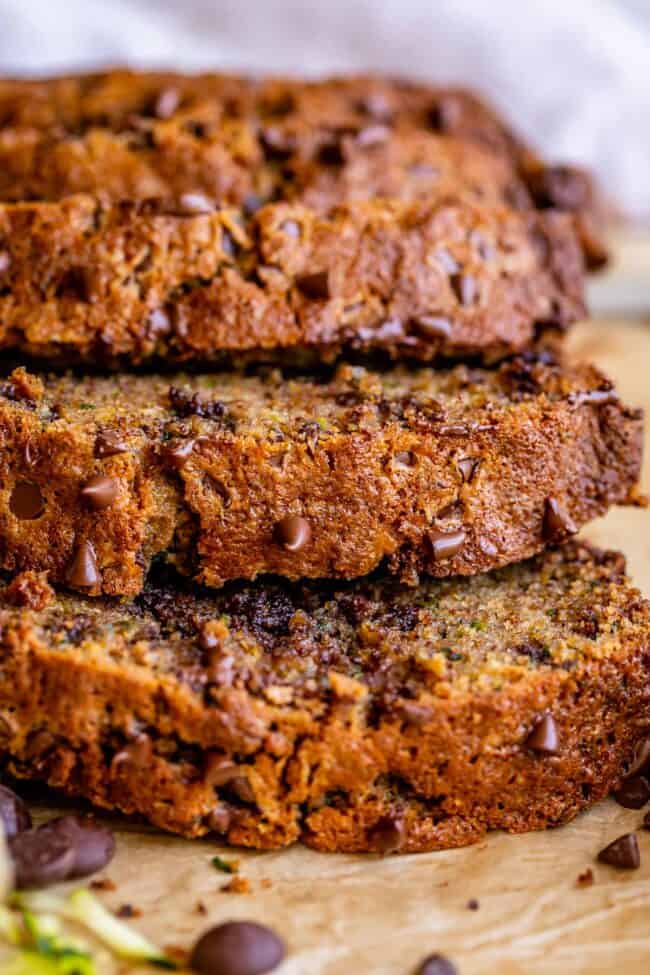 closeup side view of a few pieces of zucchini bread stacked.