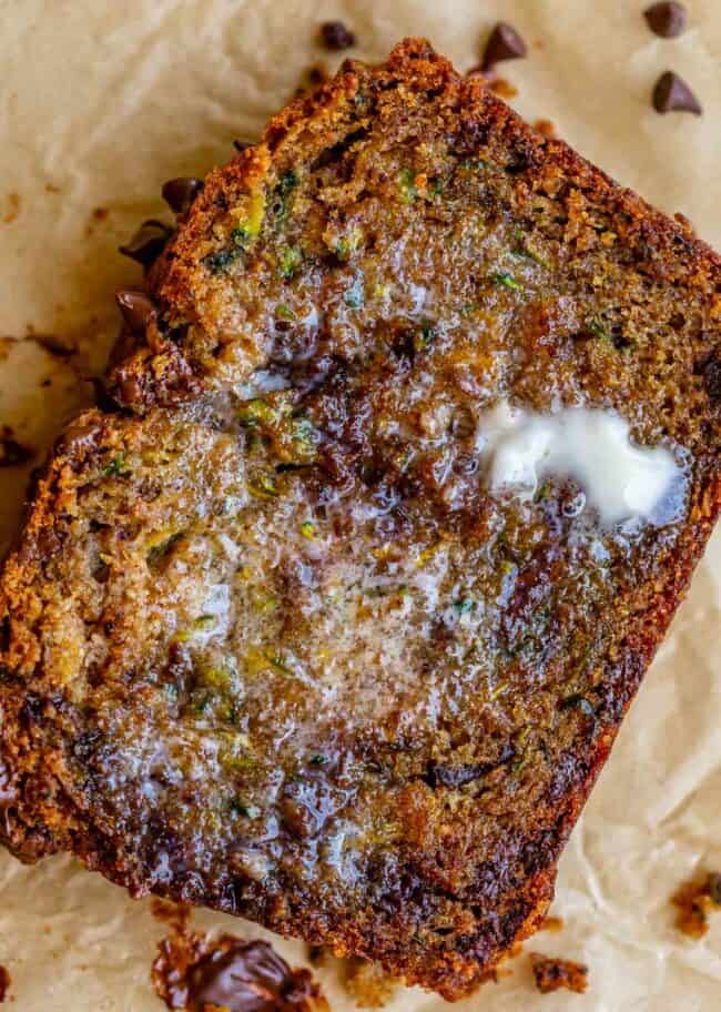 a slice of zucchini bread with melted butter on it. 