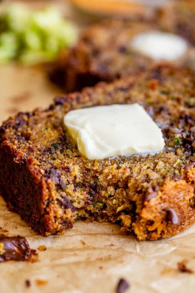 zucchini bread topped with a pat of butter.