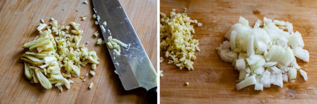 garlic minced on a wooden board with knife, onions chopped on a wooden board