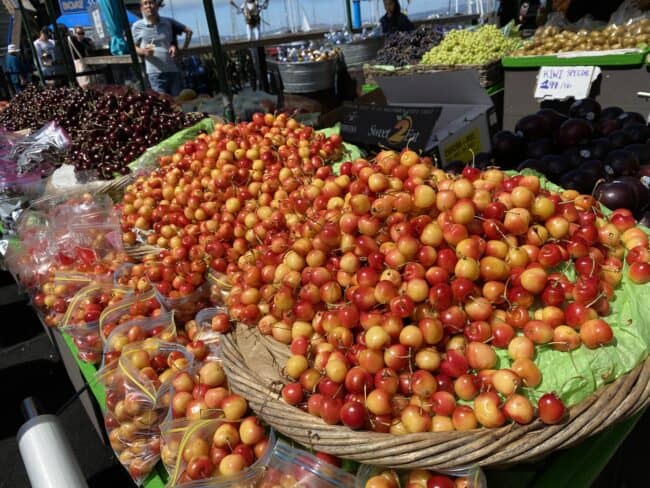 baskets of rainier cherries on Pier 39 in San Fransisco