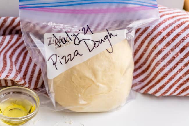 pizza dough in a ziplock bag, labeled with the date.