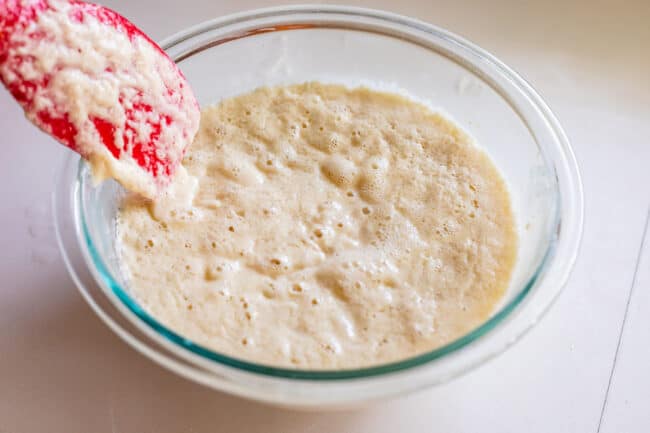 a sponge of yeast, water, and flour in a glass bowl.