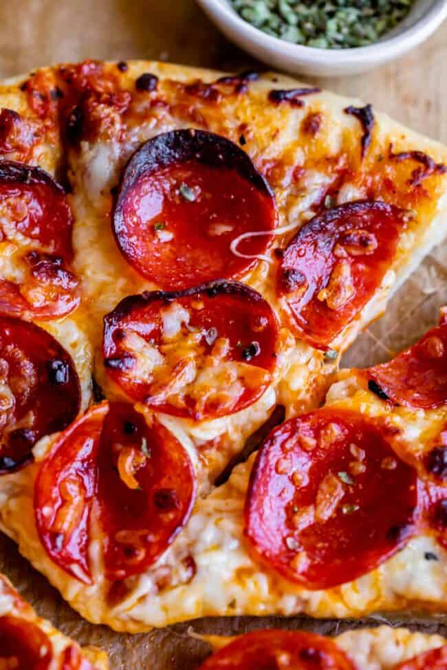 best homemade pizza with pepperoni on cutting board