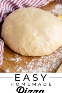 easy pizza dough recipe in a ball on a board