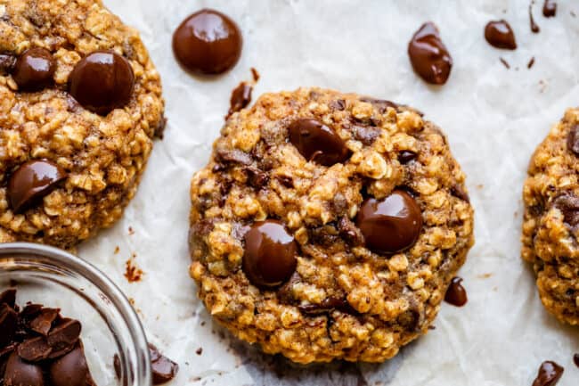 healthy oatmeal chocolate chip cookies on parchment paper.