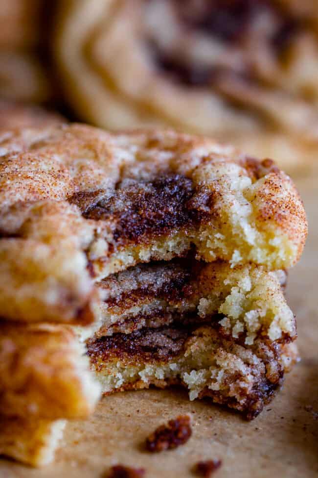 soft cinnamon roll cookies stacked up with bites taken out