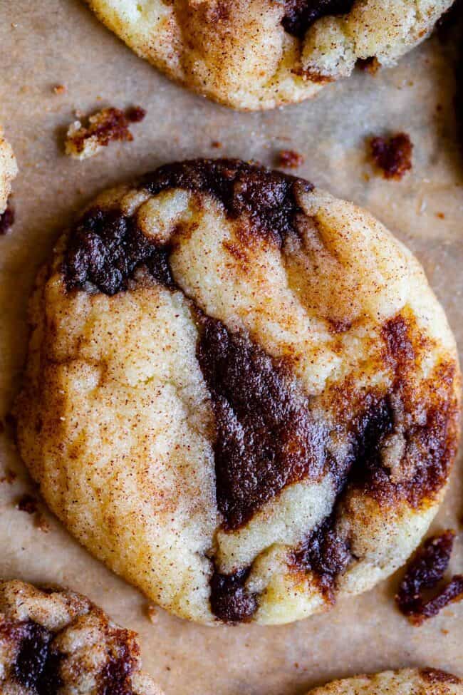 cinnamon roll cookies recipe on a baking sheet shot from overhead.