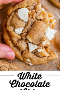 white chocolate cookies with hand holding it up