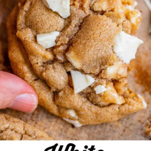 white chocolate cookies with hand holding it up