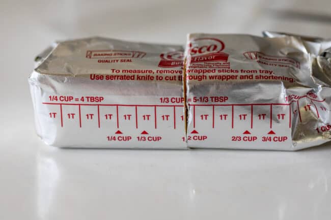 package of crisco on a countertop, cut in half