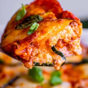 zucchini lasagna slice held up on a spatula