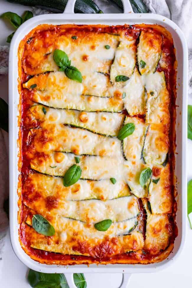 zucchini lasagna recipe in a white casserole dish