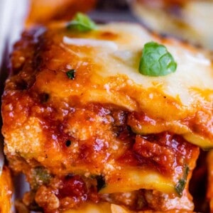 lasagna being lifted from the pan on a spatula