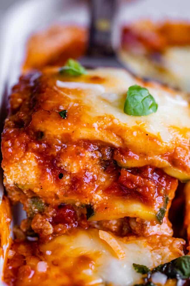 zucchini lasagna being lifted from the pan on a spatula