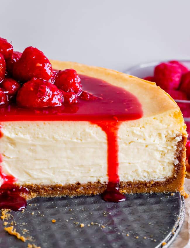 best cheesecake recipe on a pan with raspberry topping