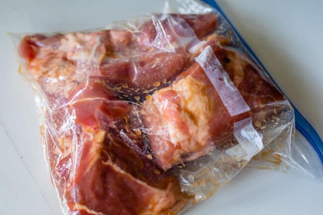 pork shoulder in a ziplock bag with marinade