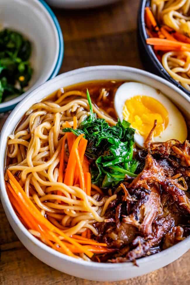pork ramen recipe in a white bowl with egg and carrots