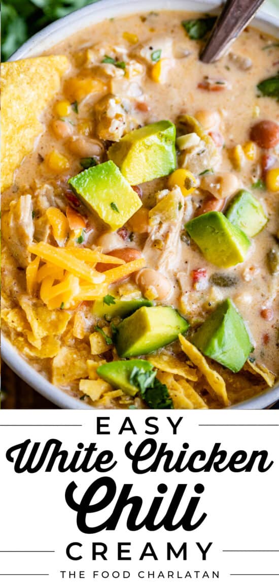 White chicken Chili with avocados and tortilla chips in a bowl