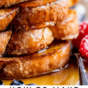 a stack of french toast with syrup dripping down and butter on top.