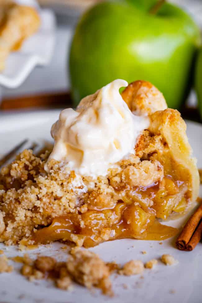 best dutch apple pie recipe on a plate with cinnamon sticks and vanilla ice cream