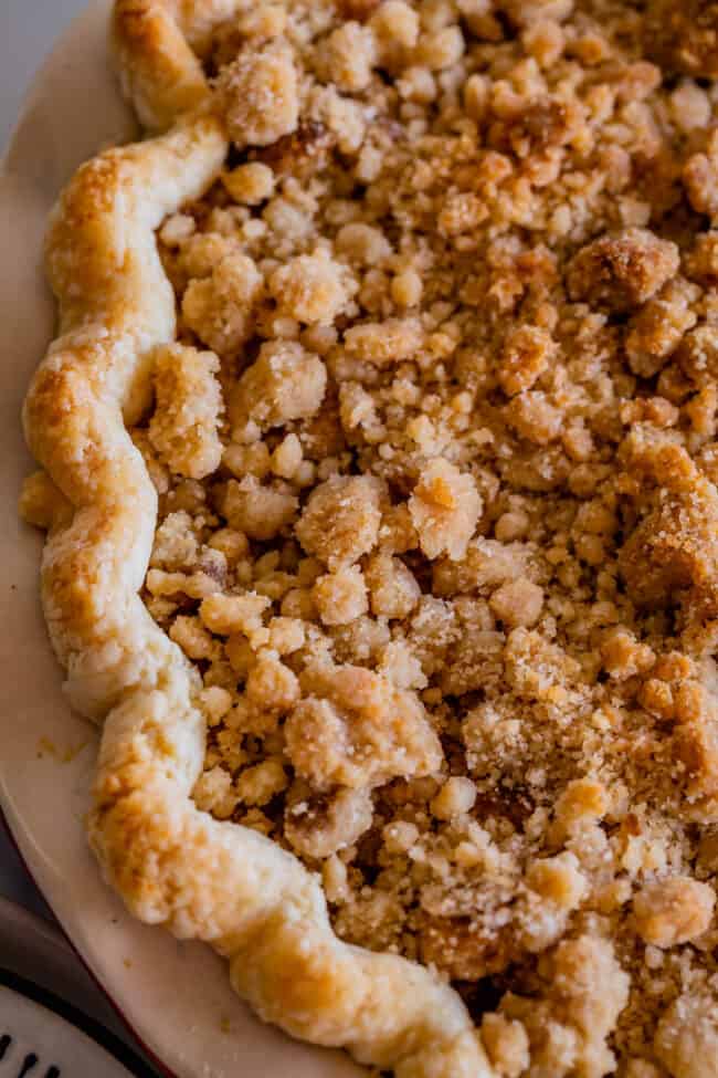 close up overhead shot of streusel on top of apple crumble pie.