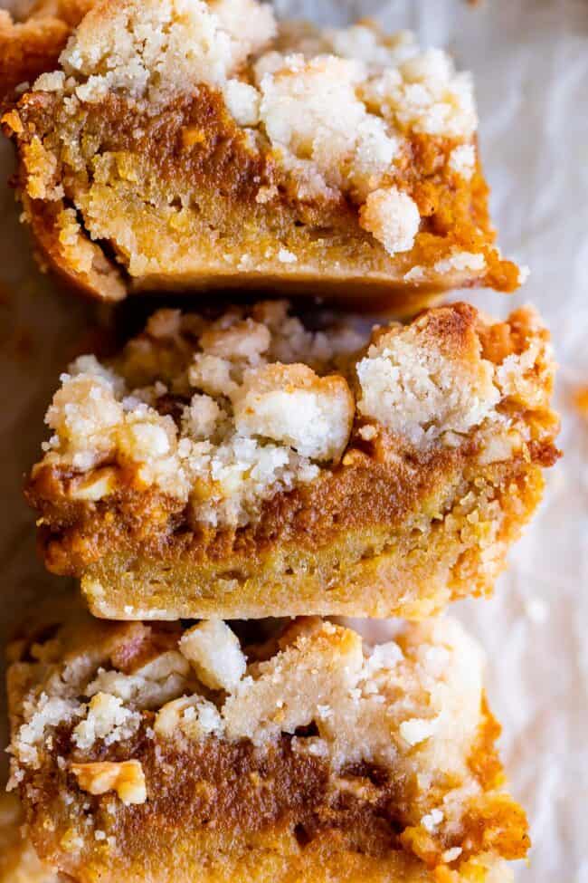 pumpkin pie bars with shortbread crust stacked together