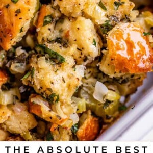 best stuffing recipe being lifted with a spoon from the pan