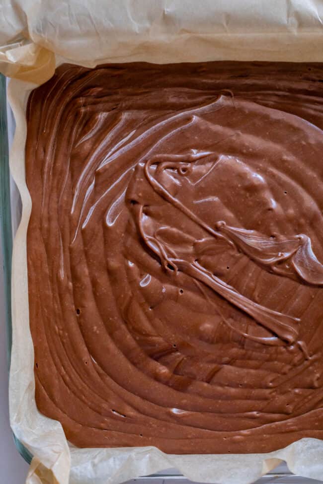 rippled fudge in a parchment lined pan shot from overhead.