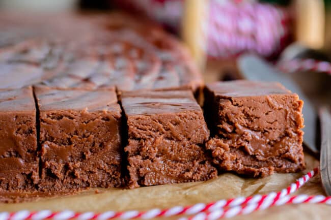 marshmallow fluff fudge on parchment paper with red string.