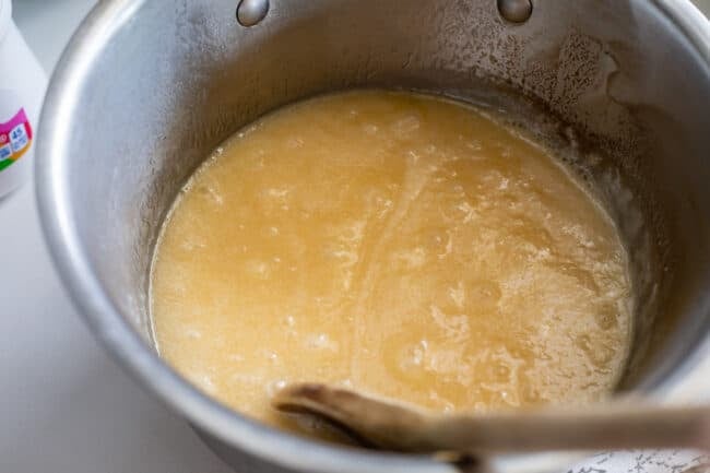 bubbles coming up from the center of a pot of butter and sugar