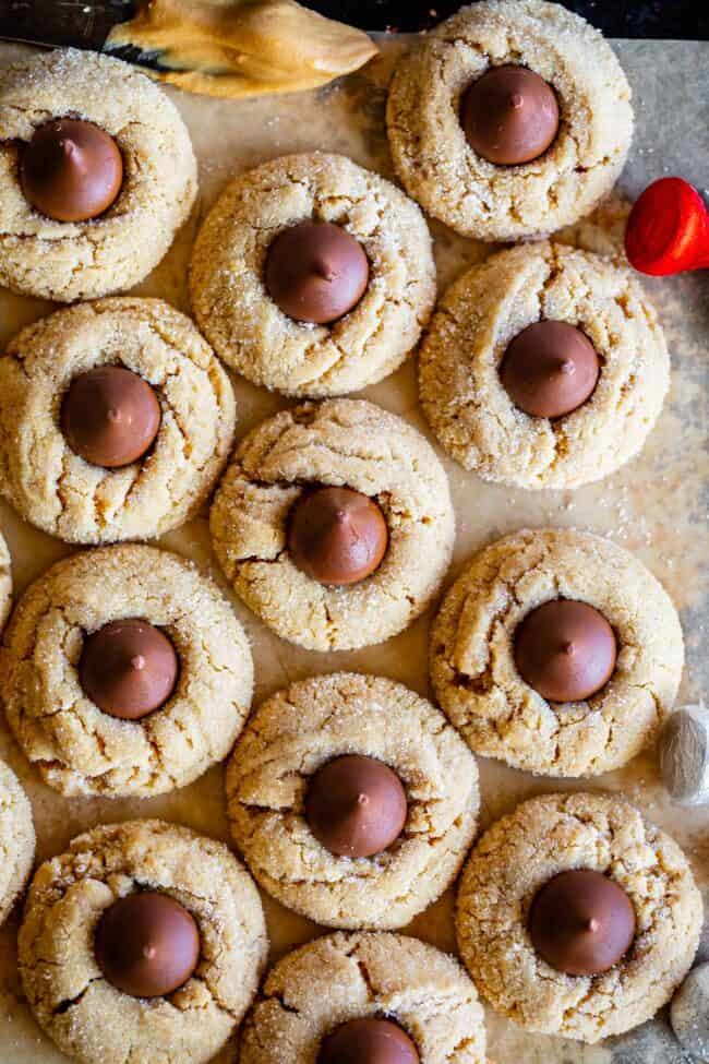 overhead shot of peanut butter blossom kiss cookies lined up on a tray.