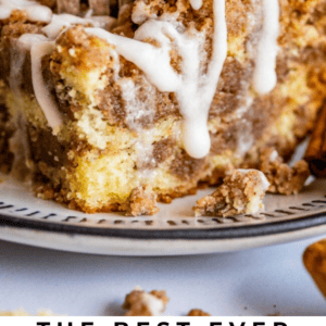 A fork cutting into a slice of sour cream coffee cake topped with white icing and cinnamon streusel, on a plate. Text below reads: Sour Cream Coffee Cake with Cinnamon Streusel – deliciously moist and flavorful.