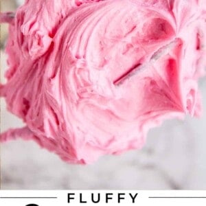 pink tinted buttercream frosting on a whisk attachment beater