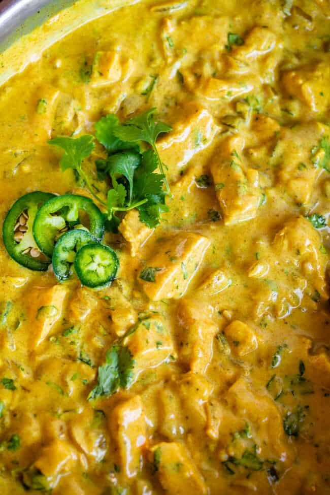 close up of Indian chicken curry recipe in a pan with jalapeno.