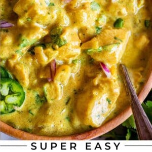 wooden bowl of easy chicken curry with spoon